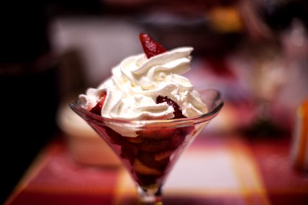 Selective Focus Photography of Ice Cream Top With Strawberries photo
