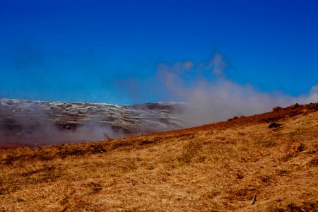 Brown Grassy Plain Under Sunny Sky photo