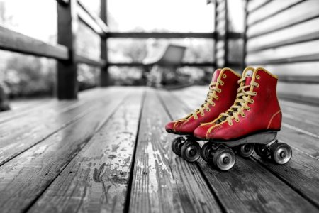 Selective Color Photography of Red Rolling Skates photo