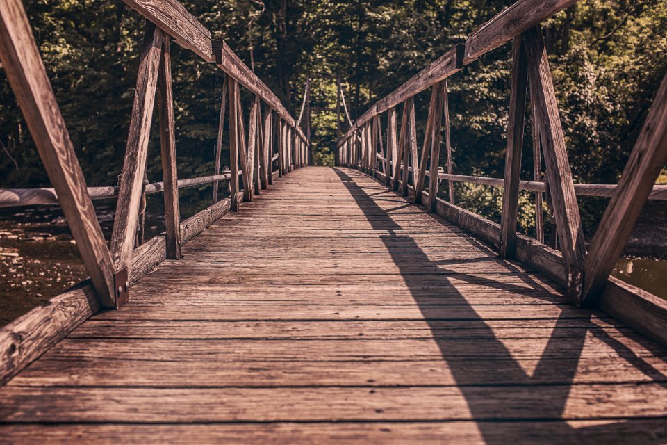 Alley Photography of Brown Wooden Bridge photo