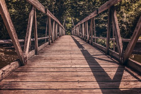 Alley Photography of Brown Wooden Bridge photo