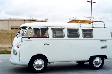 Two Person Riding White Volkswagen T2 photo