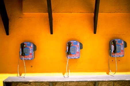 Three Blue-and-black Telephones photo