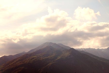 Green and Brown Mountain Peak With White Clouds photo