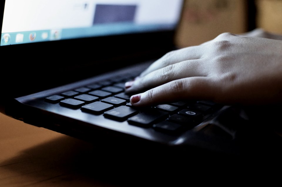Person Using the Black Laptop Computer