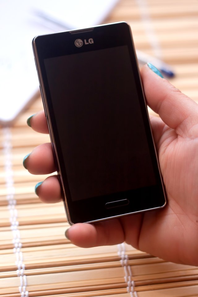 Person Holding Black Lg Smartphone