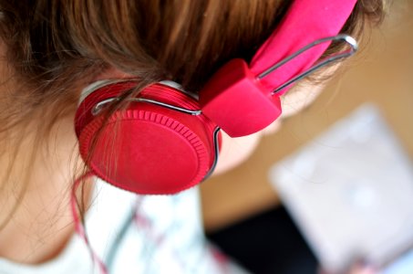 Woman Wearing Pink Headphones photo