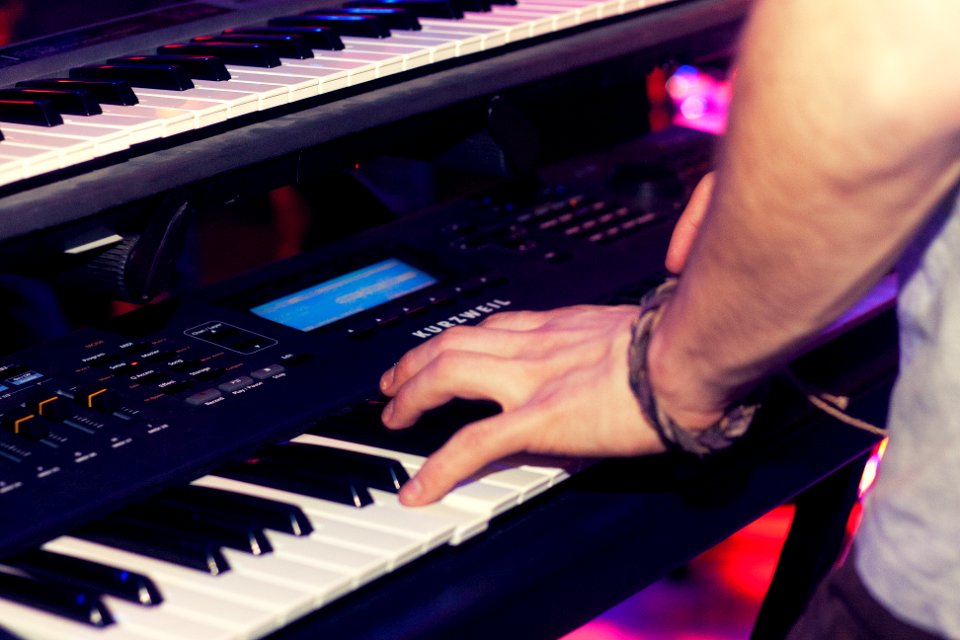 Person Playing Electronic Keyboard