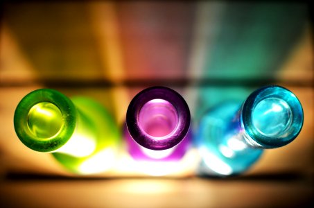 Purple, Green, and Blue Glass Bottles photo