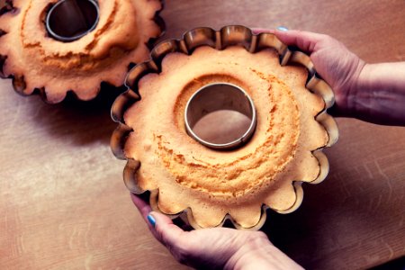 Person Holding Pan With Baked Pastry photo
