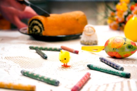 Yellow Chick Toy Surrounded by Assorted-color Crayons on Table Top photo