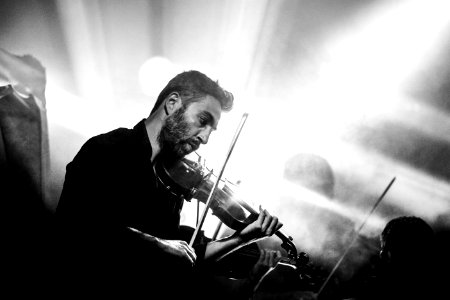 Greyscale Photography of Man Playing Violin photo