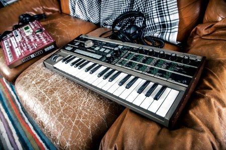 Gray Electronic Keyboard on Sofa photo
