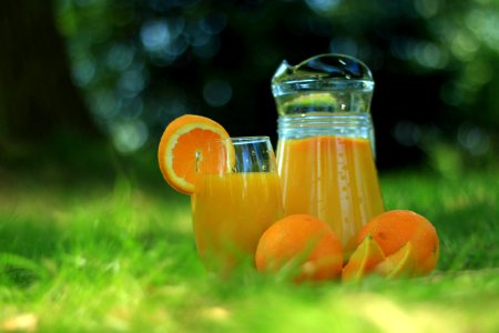 Clear Glass Cup Filled With Orange Juice photo