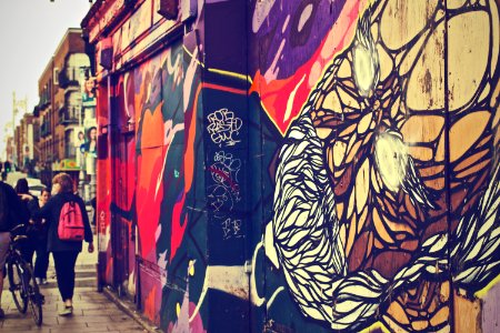 Walking Woman Beside Graffiti Art photo