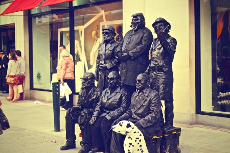 Six Soldier Statues Beside White Building photo
