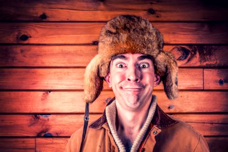 Man Making Face With Brown Head Gear photo
