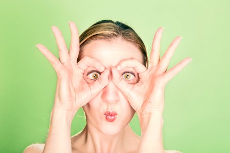Woman Doing Goggles Hands Gesture photo