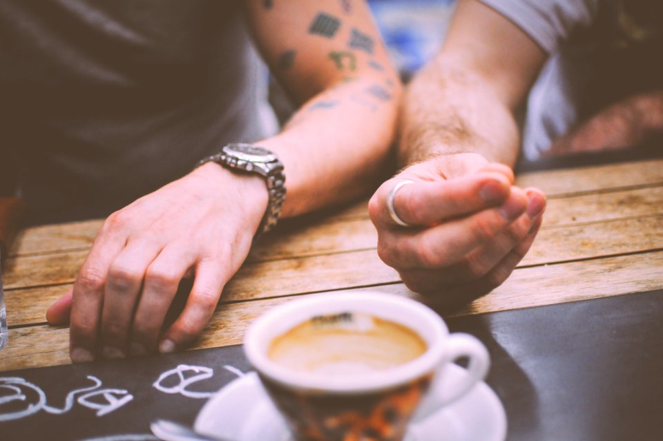 Two Person Sitting Beside Table