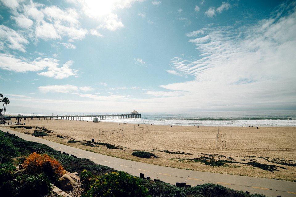 White Sand and Sea Under Blue Sky photo