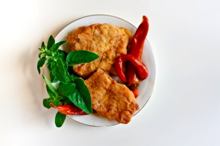 Fried fish with chili pepper and mint photo