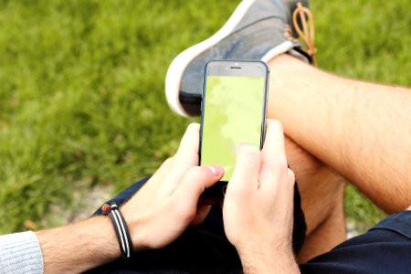 Person Holding Black Android Smartphone Outdoors photo