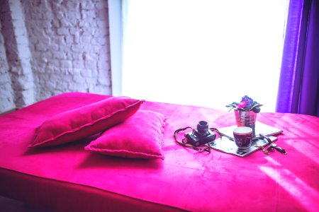 Pink bed & pillows photo