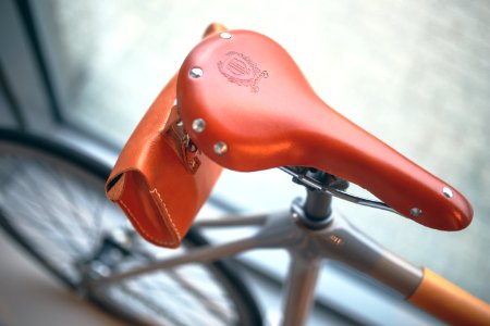 Brown leather bicycle saddle photo