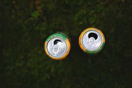 Cans in the grass photo