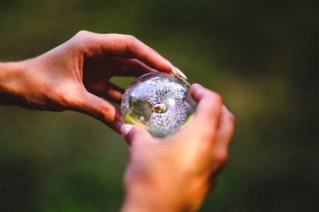 Crystal ball in hands photo