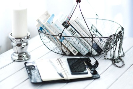 Mobile phone, notebook & books in a composition photo