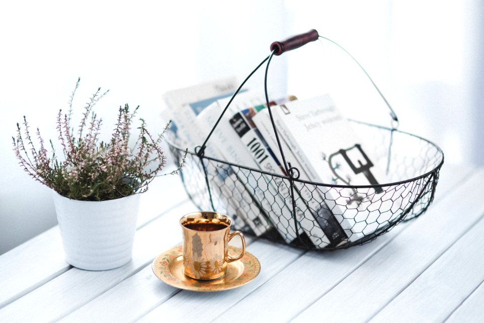 Golden cup and basket with books