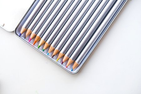 Colored pencils in open box photo
