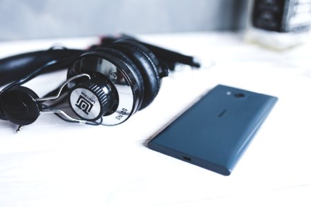 Closeup of headphones with smart phone II photo