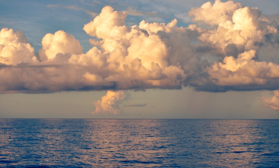 Blue Body of Water Under White Cloud photo