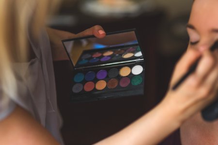 Make-up artist applying eyeshadows photo