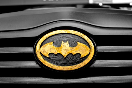 Black and Brown Batman Emblem Close-up Photography photo