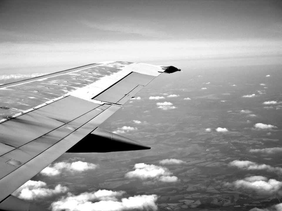 Aerial Photography of Plane Wing and Sky photo