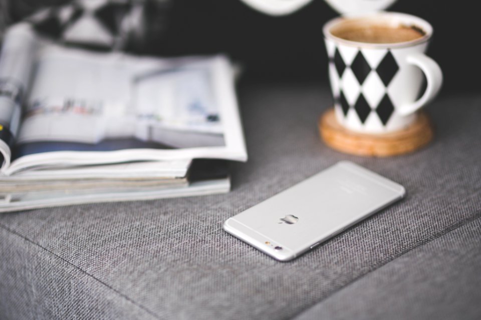 Close of phone on a grey couch