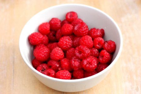Selective Focus Photography of Raspberries in White Ceramic Bowl photo