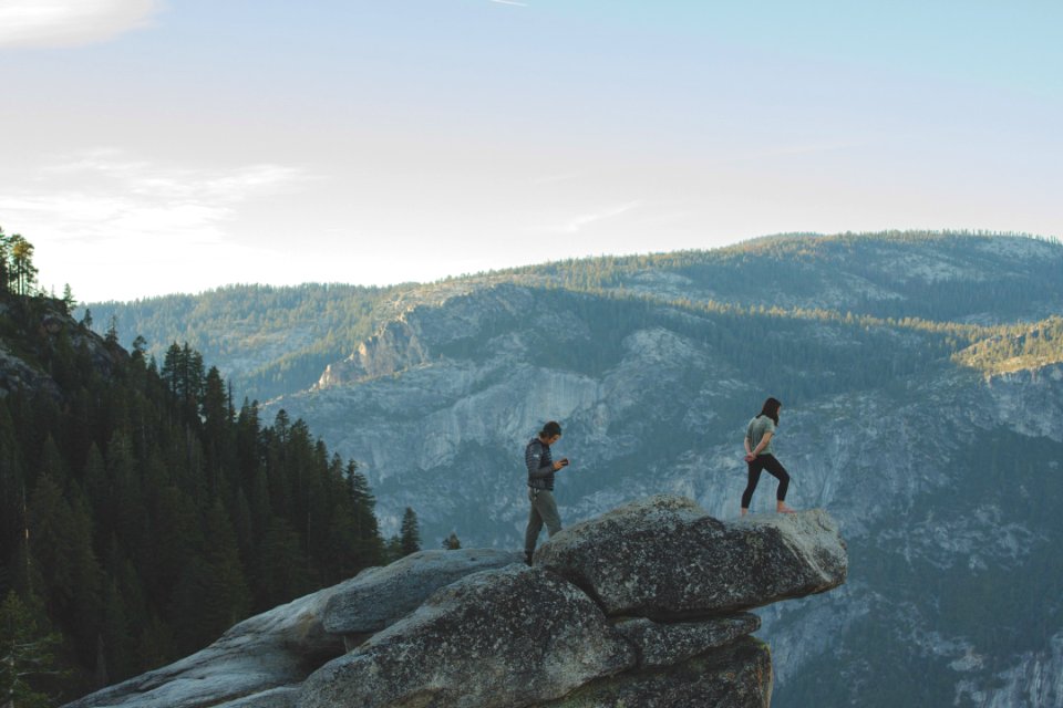 Woman Standing on Rock Formation photo