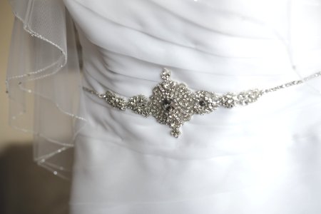 Beautiful wedding dress decoration close up photo
