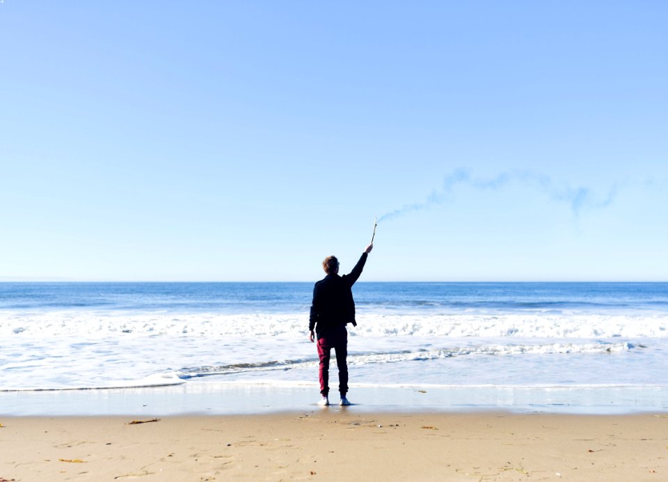 Person Standing on Seashore