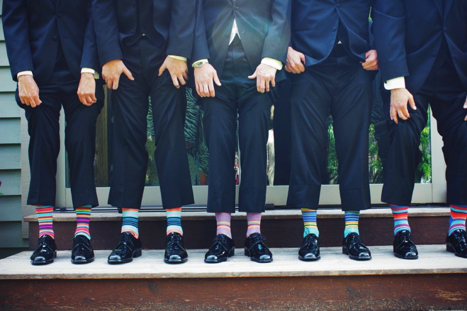 People Wearing Pair of Multicolored Socks photo