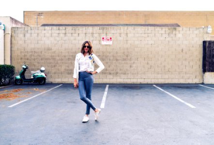 Woman Standing in Empty Parking Area photo