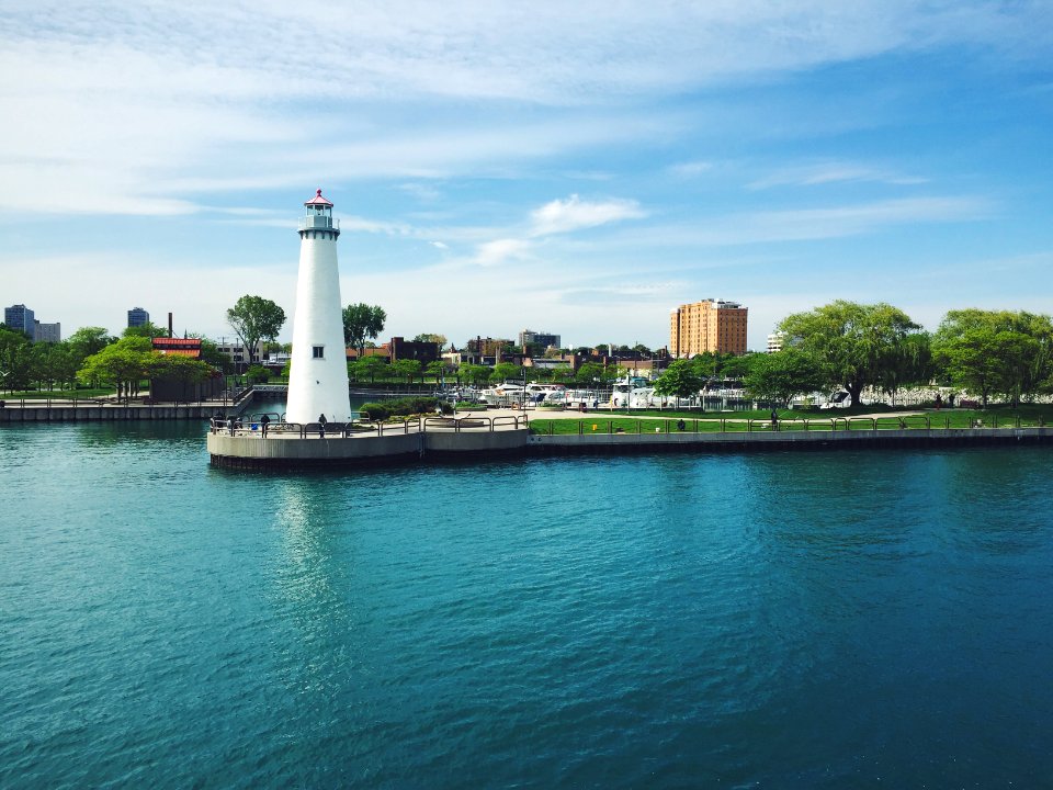 Landscape Photography of Lighthouse Near Body of Water