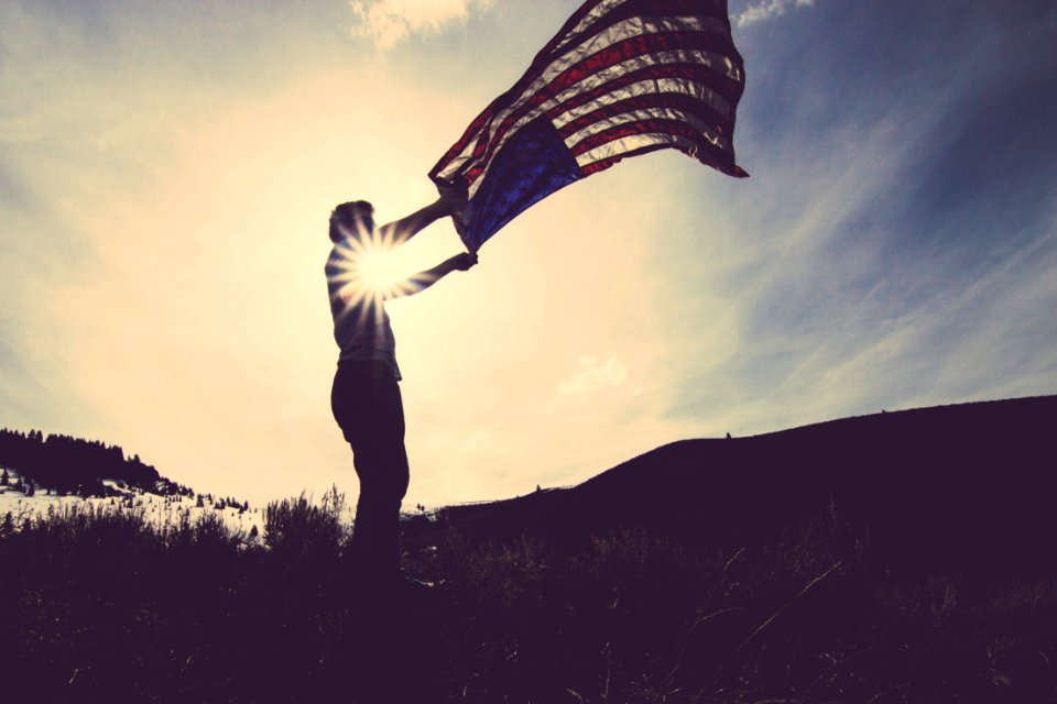 Man Holding Us Flag photo