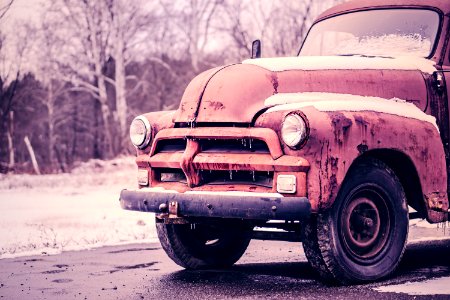 Red Vehicle Covered With Snow photo