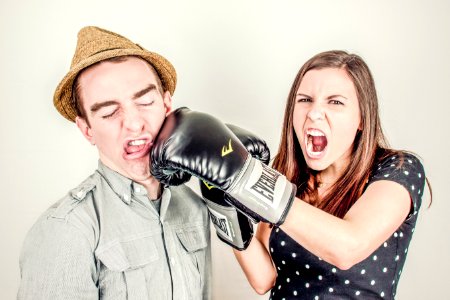 Woman Punching Men's Face photo