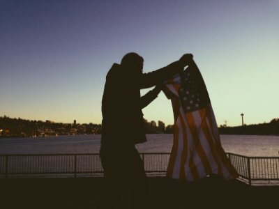 Man Holding Flag of Usa photo